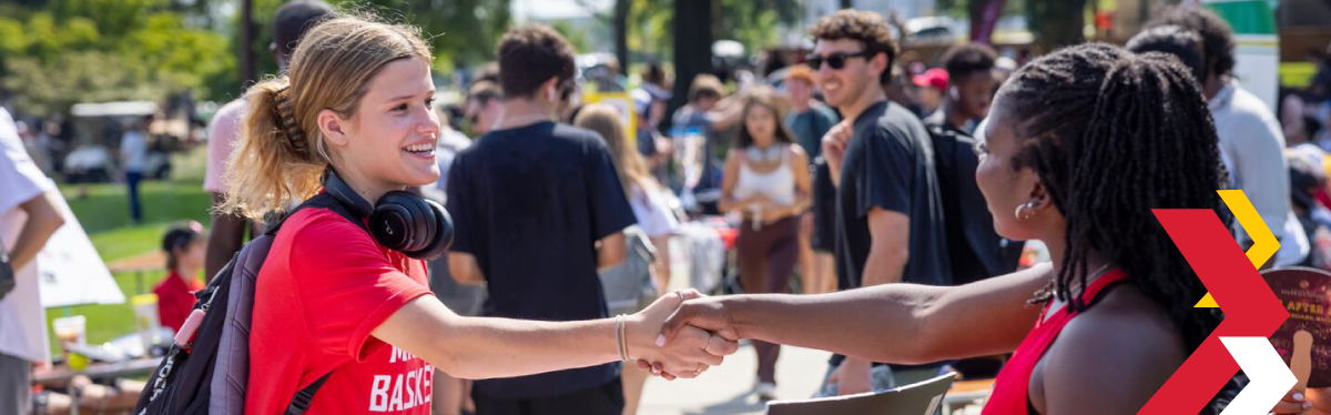 students walking on campus in the fall
